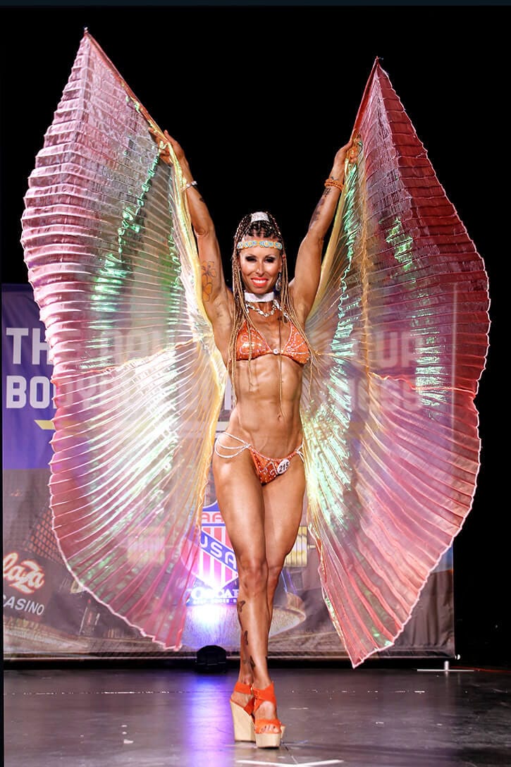 A woman in a Bikini contest wearing angel wings